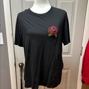 Black crew neck short sleeve t-shirt with graphic design